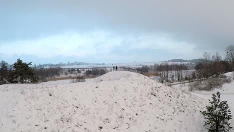 Girls-trying-yoga-on-snowy-hill