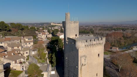 aerial rising shot of the medieval tour philippe le bel in villeneuve les avignon