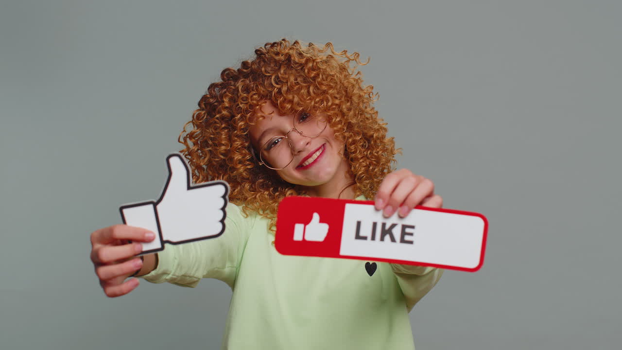 Happy teen child girl kid showing thumbs up like sign banner social media logo positive feedback