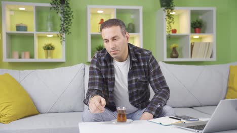 Thoughtful-man-at-home-in-a-pensive-and-unhappy-mood.