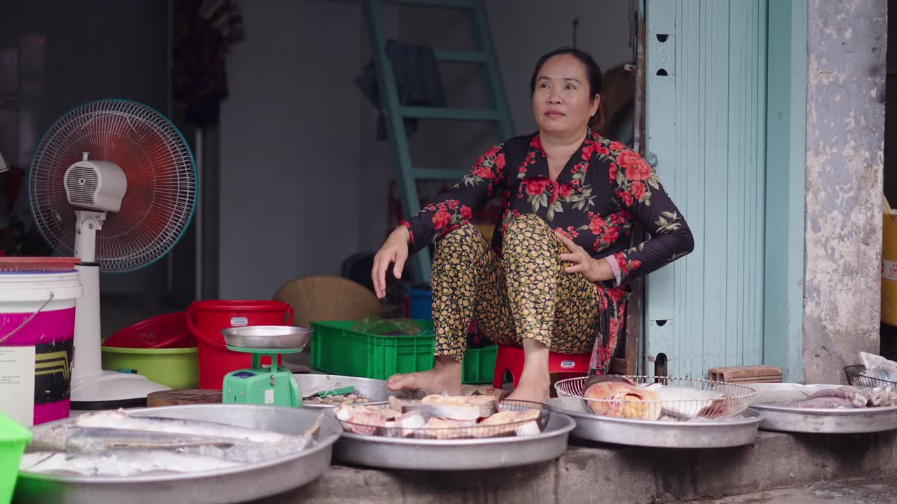 Woman Selling Fish in a Market