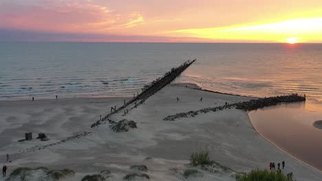 Drone-aerial-view-of-summer-sunset-in-Sventoji,-Lithuania