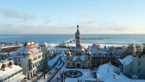 aerial view of beautiful snowy city of sopot during sunny day in winter