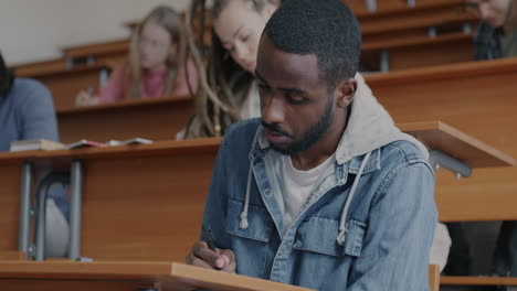 student taking notes in a classroom