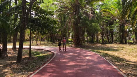 couple running in a tropical park