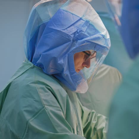 process of trauma surgery operation. group of surgeons in operating room with surgery equipment