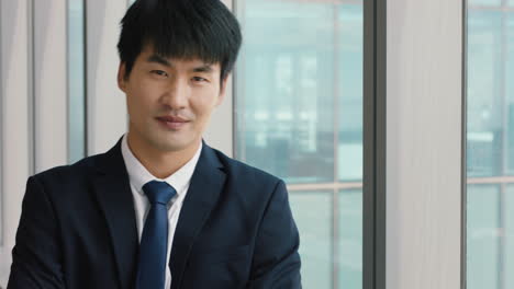 portrait asian businessman smiling confident male executive in office enjoying successful career in corporate leadership company manager at work