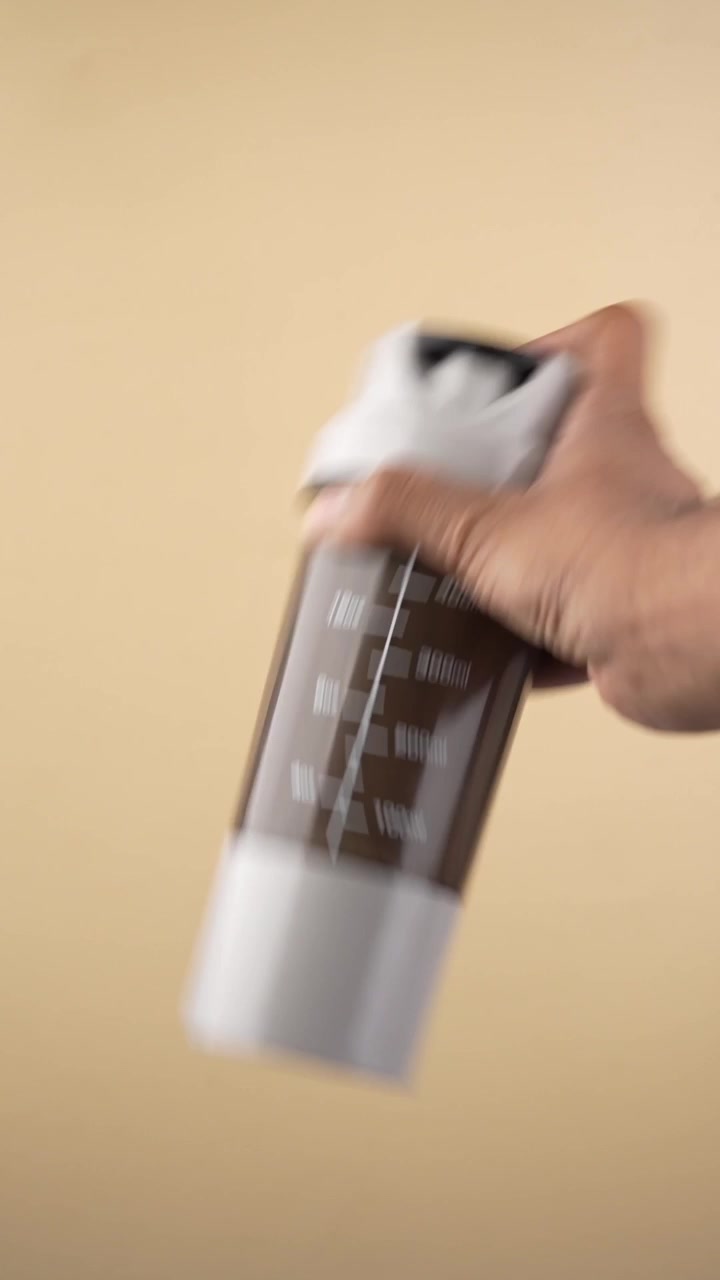 Man Shaking Protein Shaker Bottle for Post Workout Nutrition