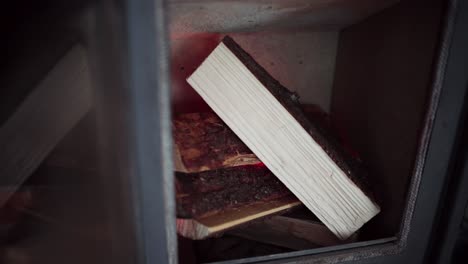 wood pieces are being incinerated in the firebox in indre fosen, trondelag county, norway - close up