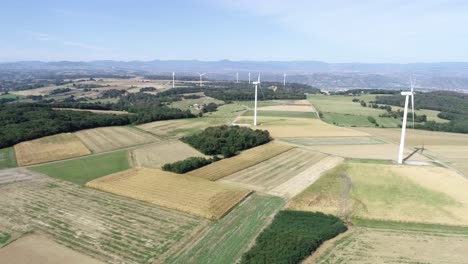 Beautiful-drone-shot-of-windmills-on-farm-landscape