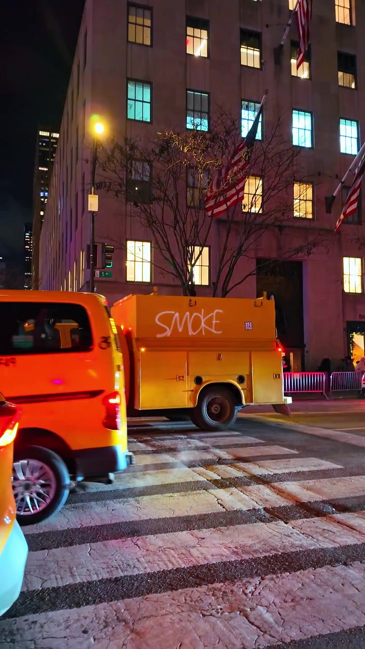 New York, USA, 25 December 2025: Smoke truck stopped on a crosswalk in New York City at night. A truck marked with the word smoke stops on a crosswalk in New York City at night.