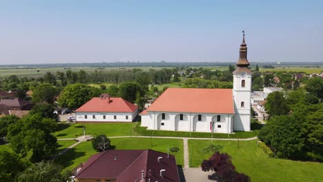 Aerial-View-Of-Reformed-Parish-Church-And-Mayors-Office-In-Szalkszentmarton,-Hungary