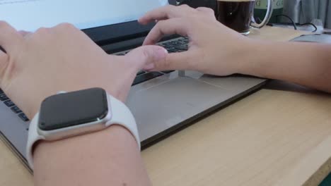 hands typing on a laptop, essential tools for a digital nomad working remotely from any location.