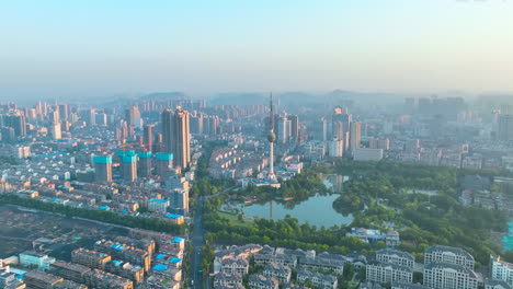 aerial view of a modern chinese city at sunrise