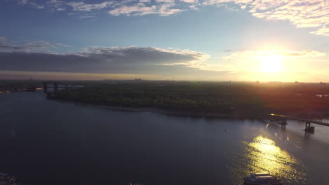 evening sunset reflecting in city river. aerial view evening city on sunset