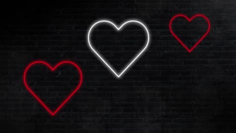 animación de corazones de neón rojos y blancos que parpadean sobre un fondo negro