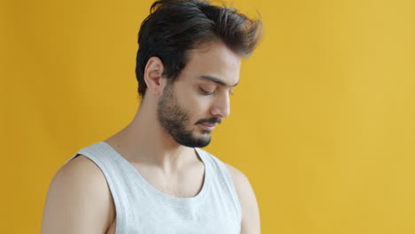 man measuring arm with measuring tape