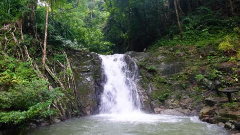 Popular-Bulalacao-Waterfalls-with-fast-flowing-white-water-into-pools-in-the-dense-jungle-of-El-Nido-in-Palawan,-Philippines,-Southeast-Asia