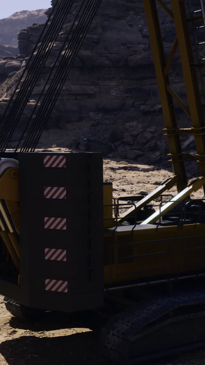 Excavator working in a rocky area during daytime
