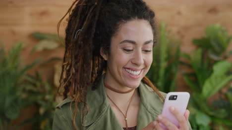 portrait of happy young woman using smartphone smiling enjoying texting browsing online messaging mobile phone communication sharing slow motion