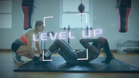 Scope-over-level-up-text-against-man-performing-sit-ups-exercise-at-gym