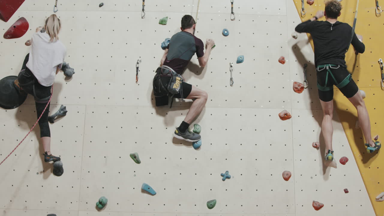 Man With Amputated Leg Climbing Wall Indoors