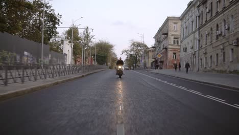 front view of a man doing stunt riding in the city