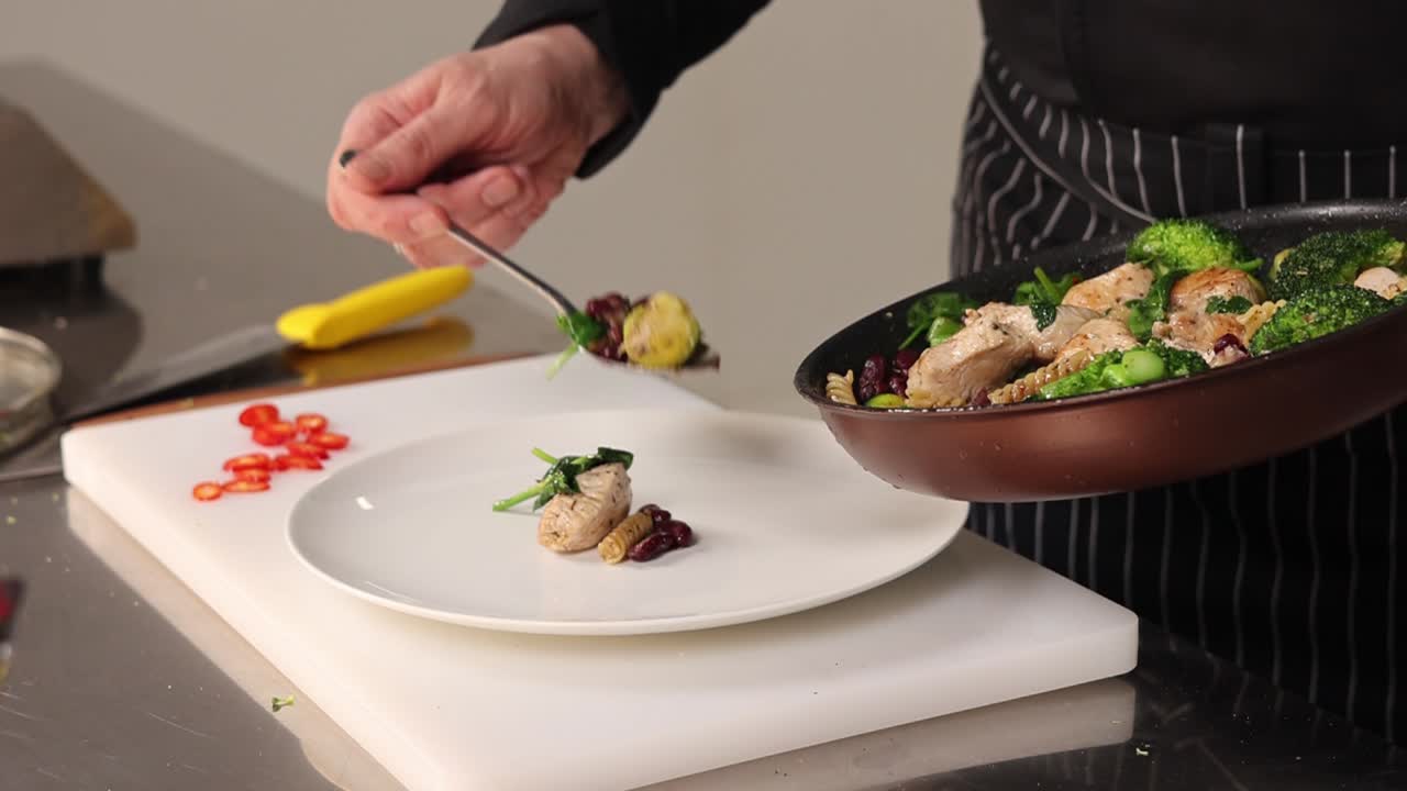 Chef preparing a healthy chicken pasta dish