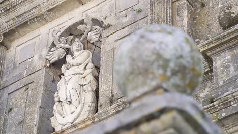 rotating shot of an engraved stone sculpture in downtown medina sidonia cadiz, españa