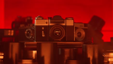 Vintage Cameras on Red Background