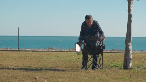 man and chair on the beach