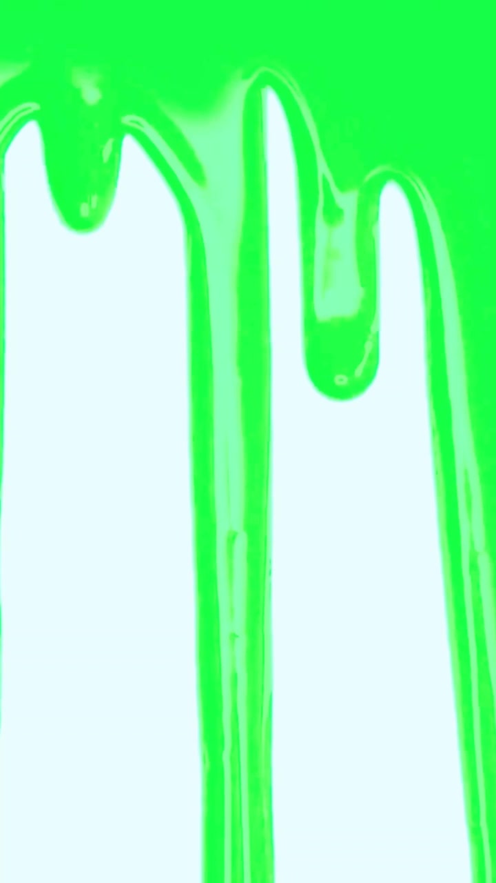 Vibrant Green Liquid Paint Dripping Down Slowly