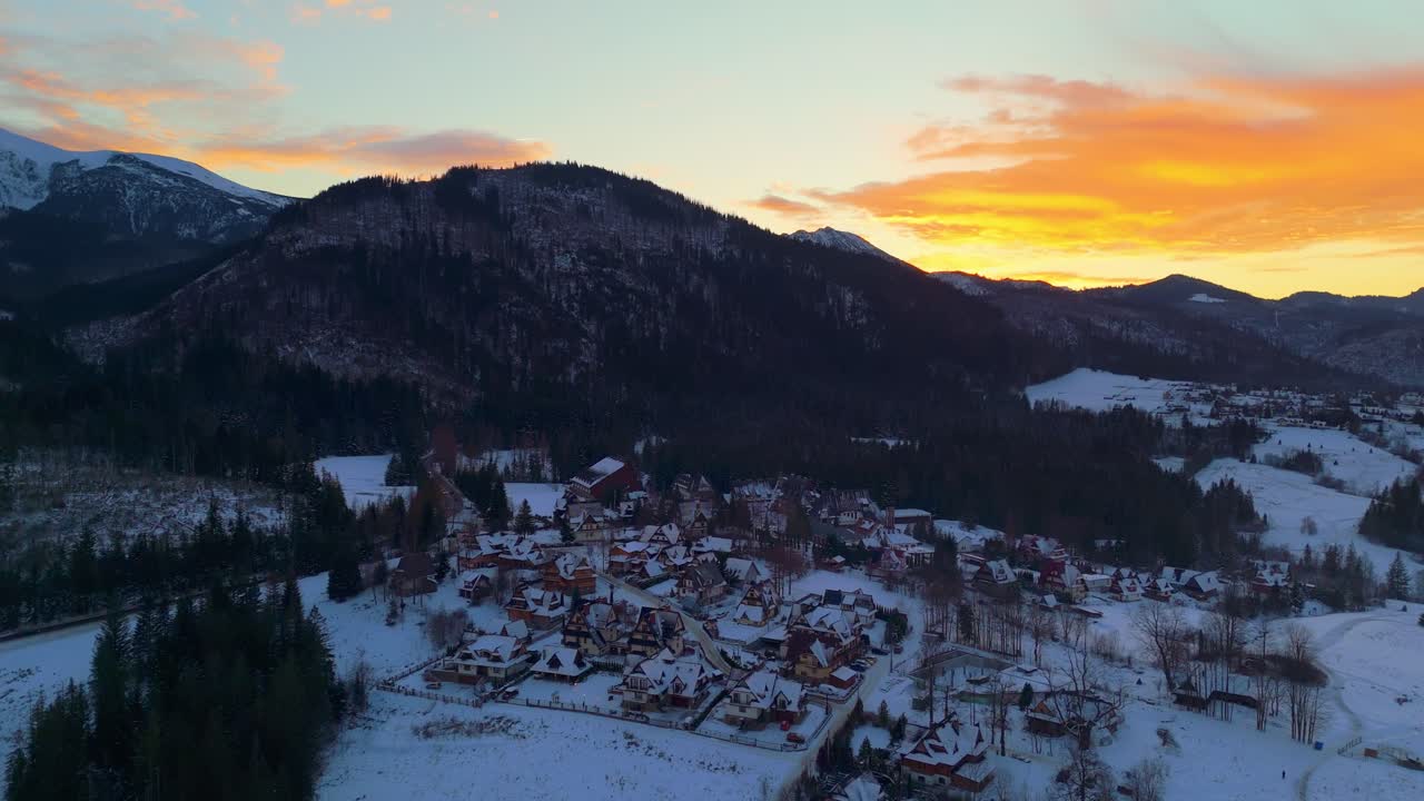 Sun dips low at Zakopane’s crest, Tatra peaks glow golden dressed