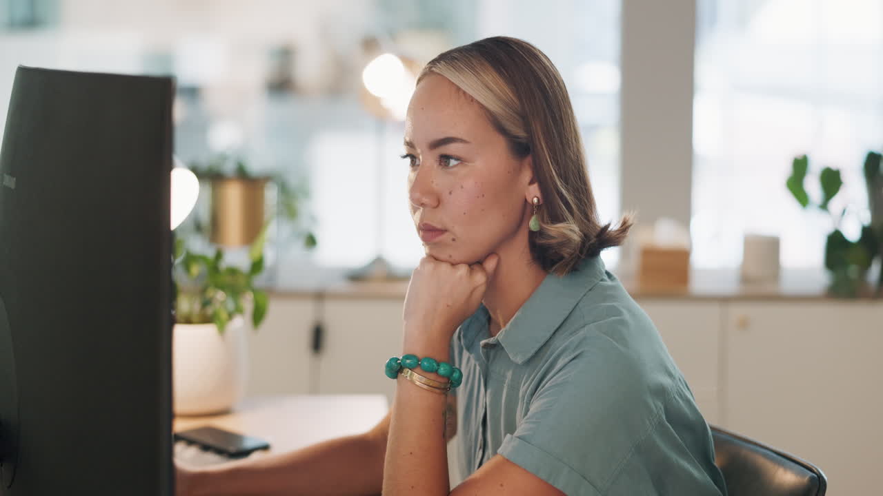 Thinking, serious or business woman with computer