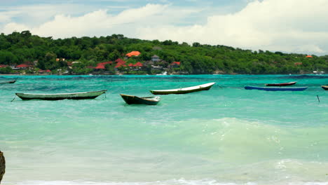 Empty-traditional-Balinese-fishing-boats-called-Jukung-moored-on-coast