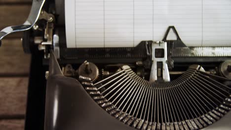 Vintage-typewriter-on-wooden-table-4k