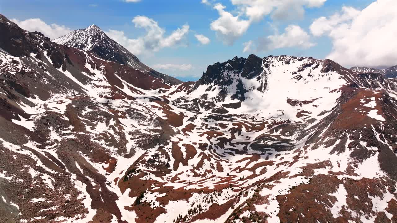 Mt Mount Lindsey Blanca Peak Sangre De Cristo Range aerial drone Colorado spring summer snow fields melting morning blue sky clouds high Rocky Mountains summit Fort Garland backwards motion