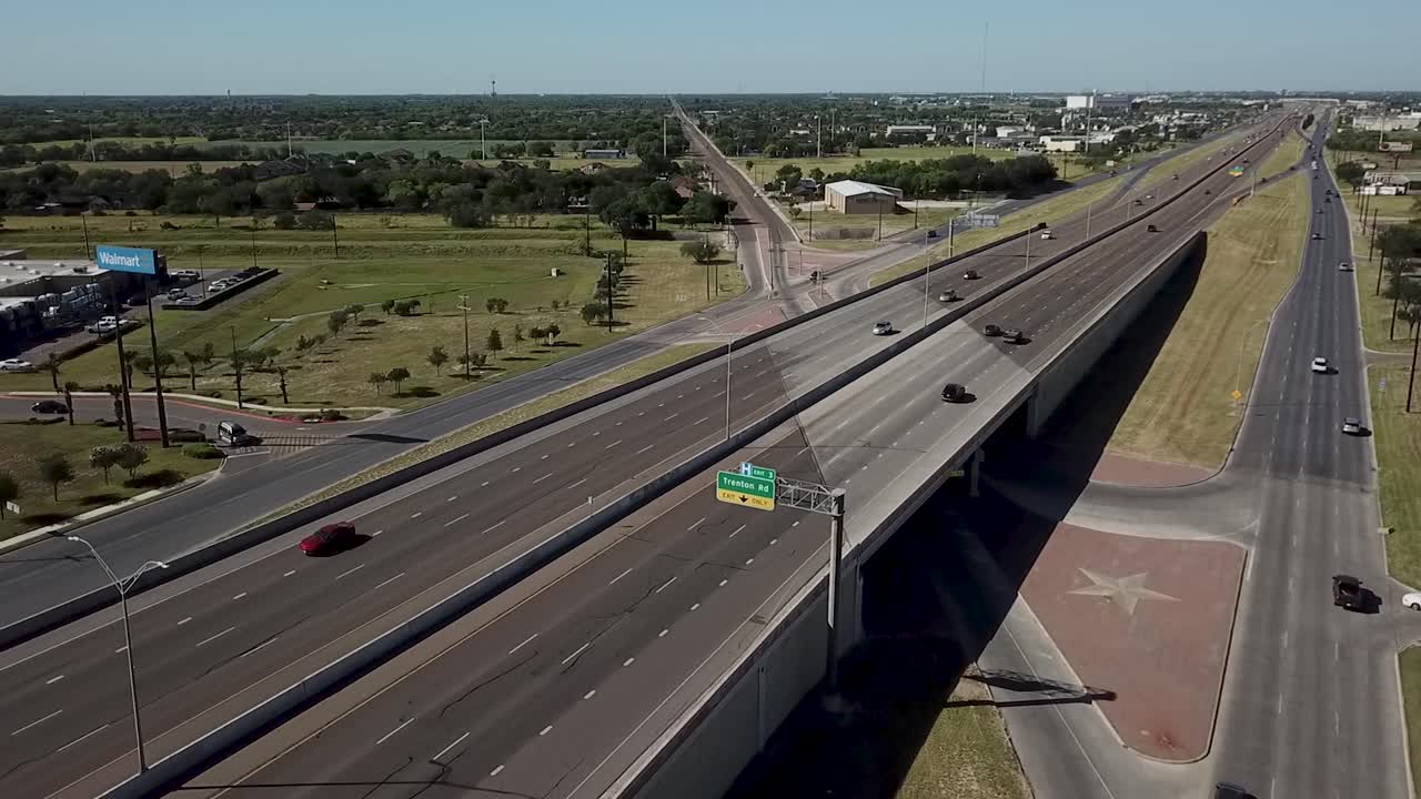 Aerial journey with perspective over Interstate 69C near the city of McAllen, Texas, on a calm Saturday morning
