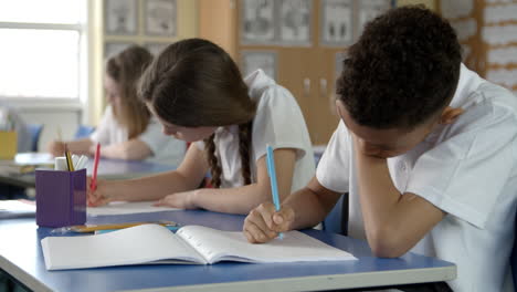 Elementary-School-Pupils-Working-In-Classroom-Shot-On-R3D