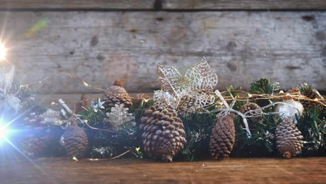 composición de luz sobre decoraciones de navidad con conos de pino