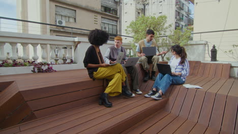 gen z business people collaborating at outdoor coworking space