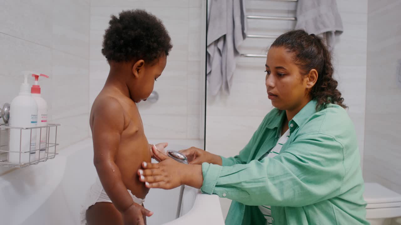 Mother Giving Baby a Bath
