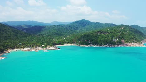 Rocky-forested-shore-between-two-sandy-beaches,-Haad-Thong-Reng-and-Haad-Than-Sadet,-Thailand