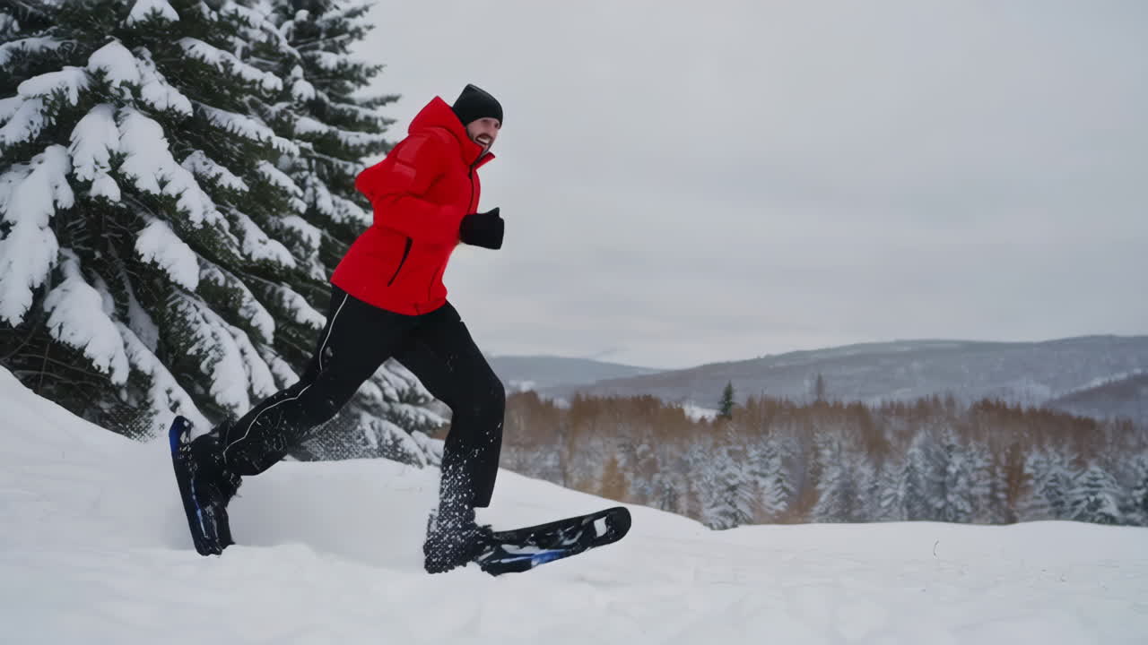 Man Snowshoeing in Winter Forest
