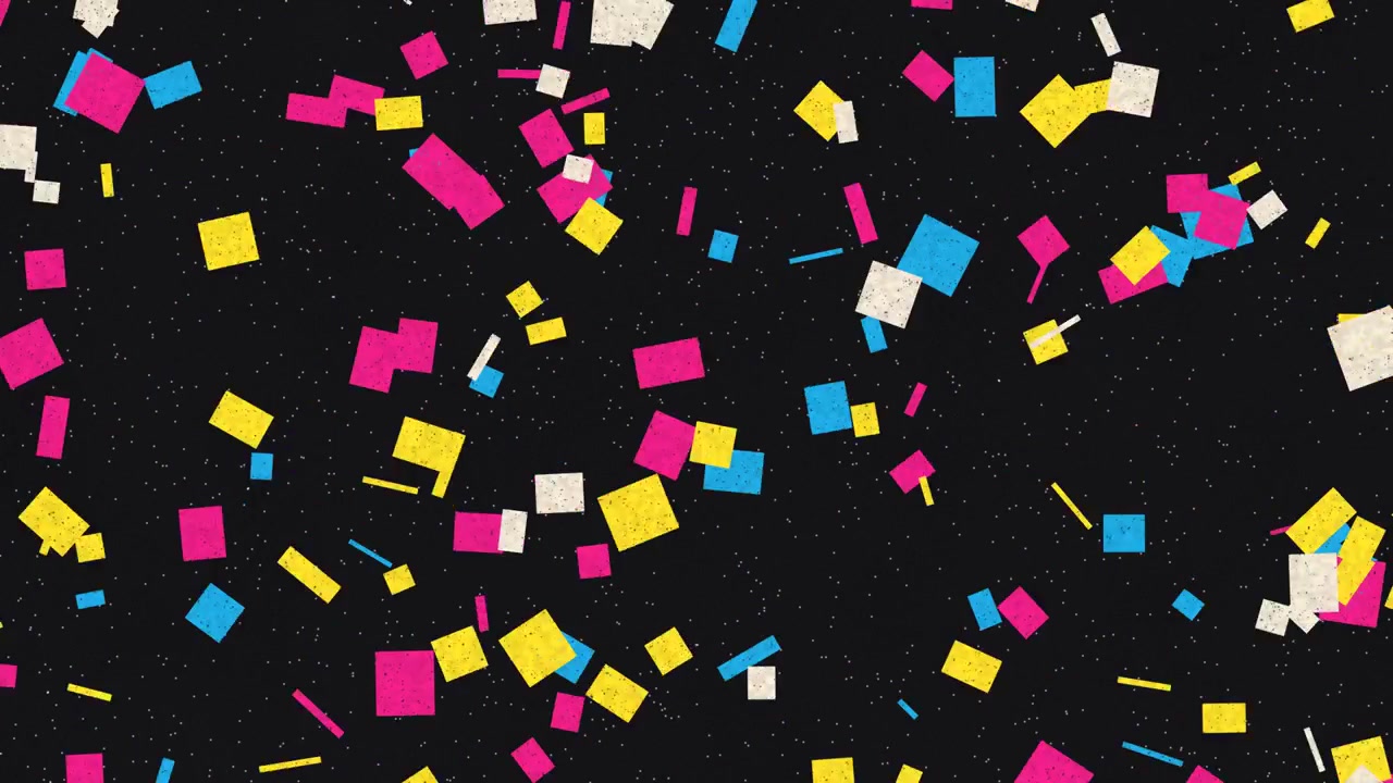 Colorful Paper Confetti Falling Against a Dark Background