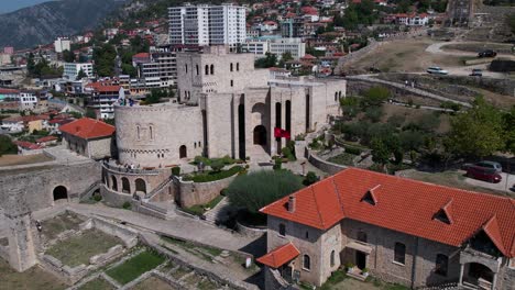 historic museum of skanderbeg inside medieval fortress with kruja city buildings background