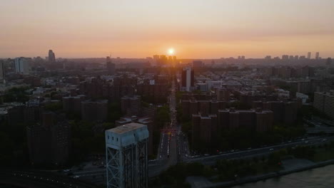 Aerial-view-of-sunset-above-the-East-135-street-of-Harlem,-in-Manhattan,-NYC