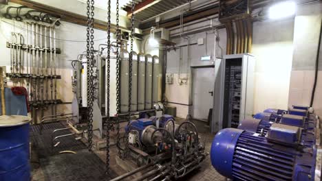 industrial machinery room with pumps and motors