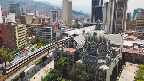 Incredible-aerial-shot-of-metro-train-and-Botero-Plaza-in-Medellin-city-center