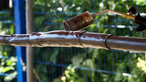 insulating a metal pipe with heat shrink wrap